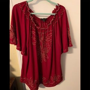 Cute blouse with flowered decor on front and back